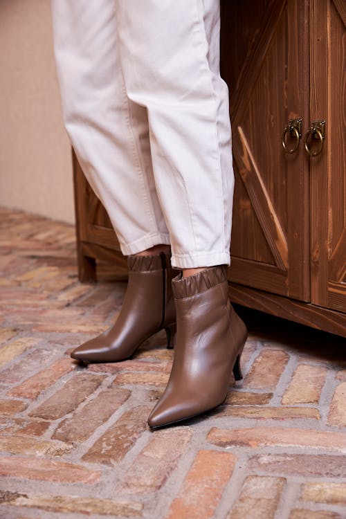 Free Person in White Pants and Brown Leather Boots Stock Photo