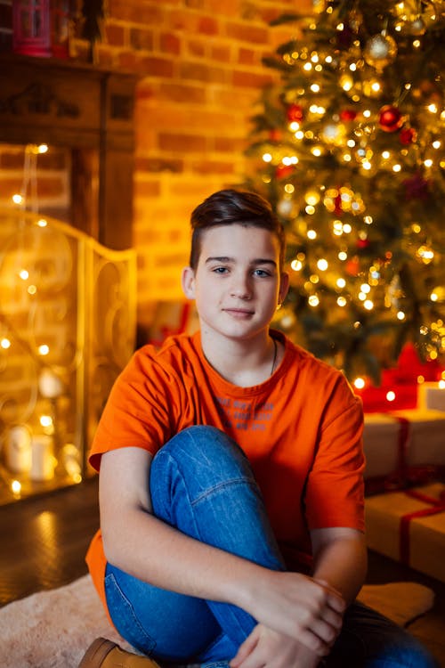 Boy in Orange Shirt and Denim Jeans Smiling 