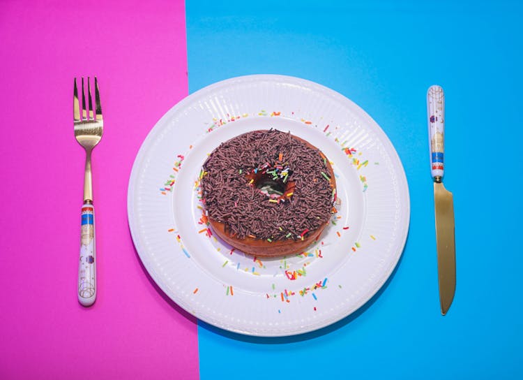 Chocolate Donut On Plate In Studio