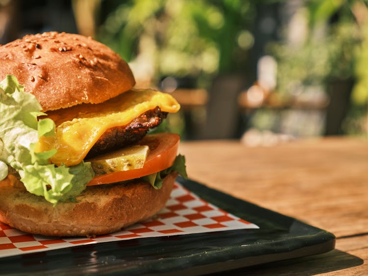 Cheeseburger On Black Ceramic Plate