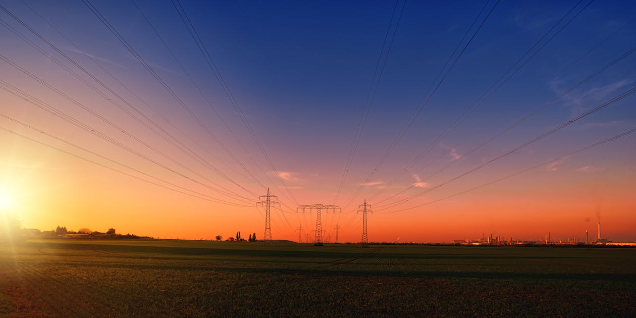 Free Photography of Electrical Towers in the Field Stock Photo