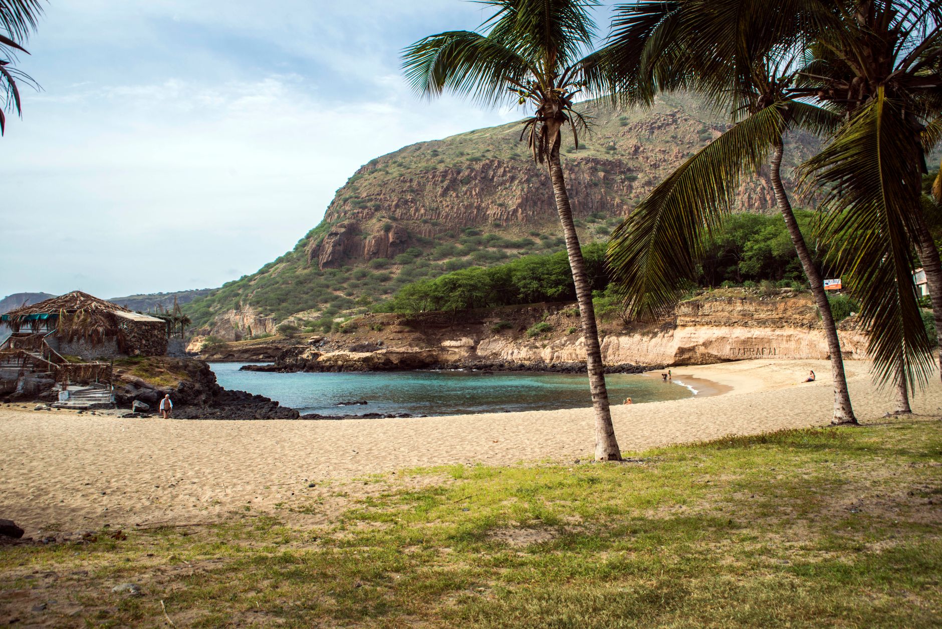 Discover the tranquil beauty of a tropical beach in São Lourenço dos Órgãos, Cape Verde, featuring lush greenery and calm waters.