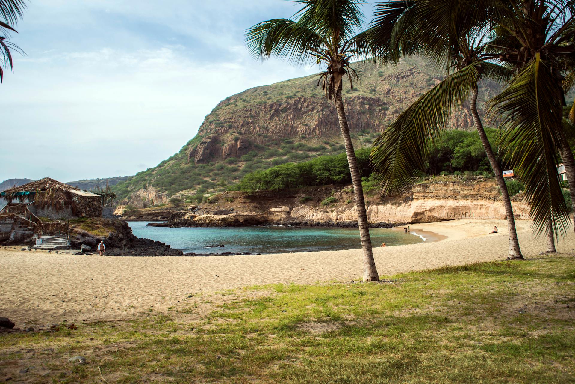 Discover the tranquil beauty of a tropical beach in São Lourenço dos Órgãos, Cape Verde, featuring lush greenery and calm waters.