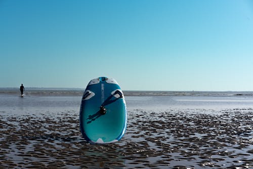 Blue Surfboard on Beach