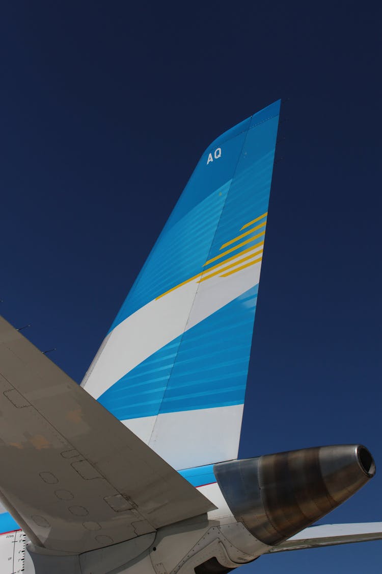Blue Empennage Of An Airplane