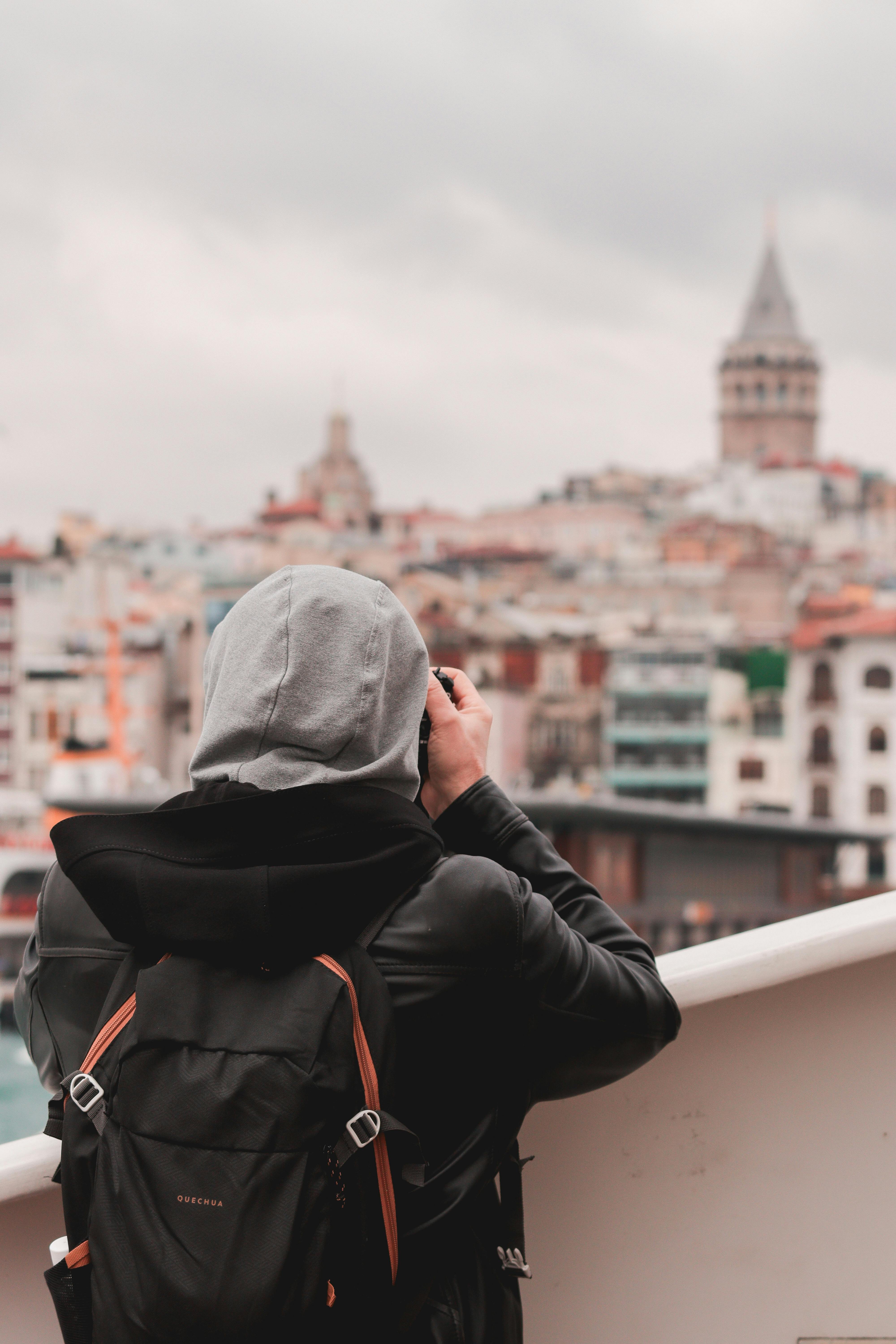 backview of person in black leather jacket