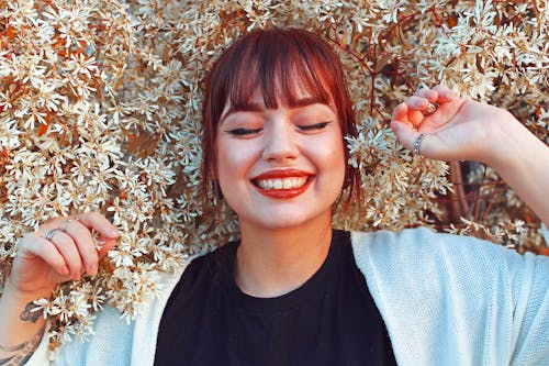 Free Woman in Black Crew-neck Top Wearing White Cardigan Stock Photo