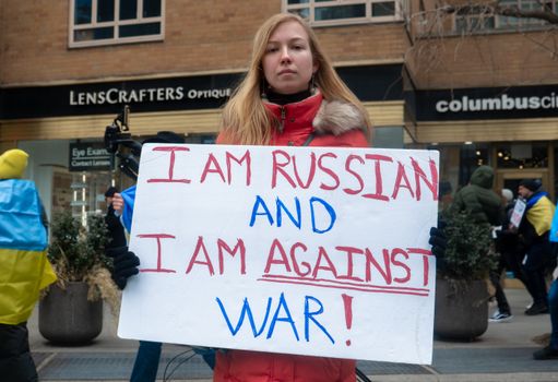 A Woman Holding a Poster