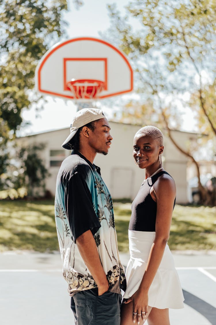 Couple Standing On Basketball Court