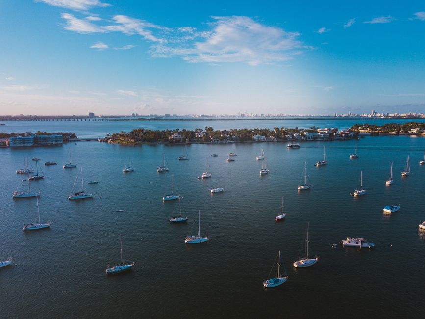 Outstanding Private 60 Minute Romantic Excursion Air Tour with Champagne Review: Miami's Most Unforgettable Couples Experience Review 2026 - Stunning aerial shot of yachts along the Miami Bay under a clear blue sky.