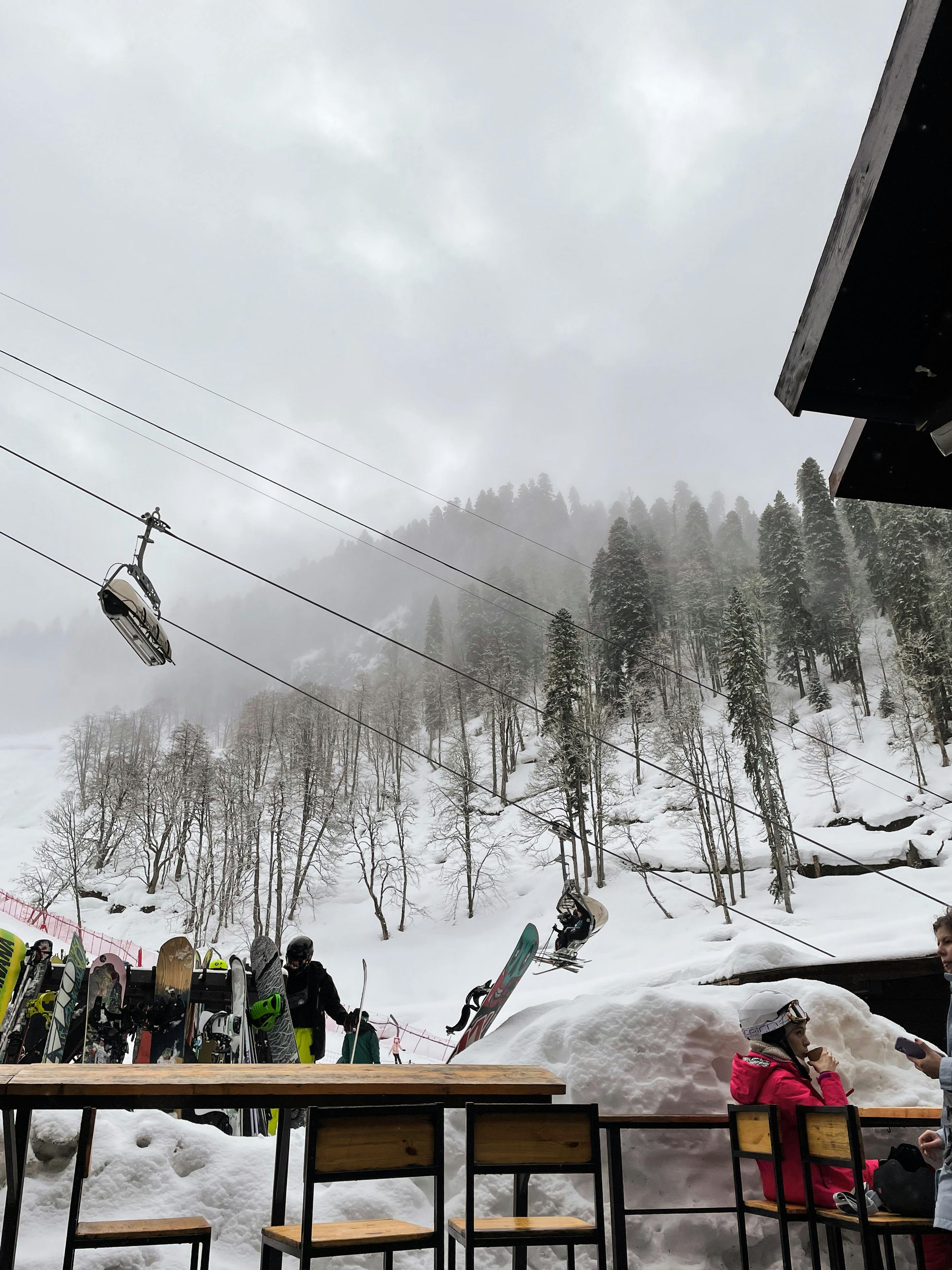 Prescription Goggle Inserts - A winter wonderland with skiers and cable cars on a snow-covered mountain.