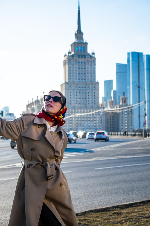 A Woman in Brown Coat Wearing Black Sunglasses · Free Stock Photo