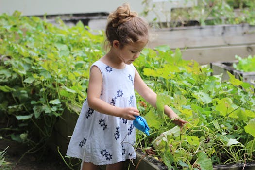 girl wearing white floral dress beside grass plant at daytime