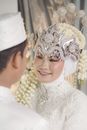 A Bride in Traditional Wedding Dress and Bejeweled Crown