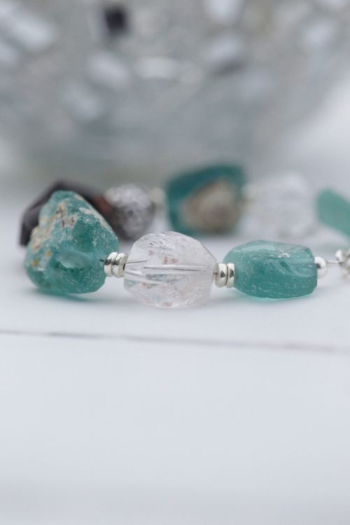 Free Close-up shot of an elegant beaded bracelet featuring natural gemstones in soft focus. Stock Photo