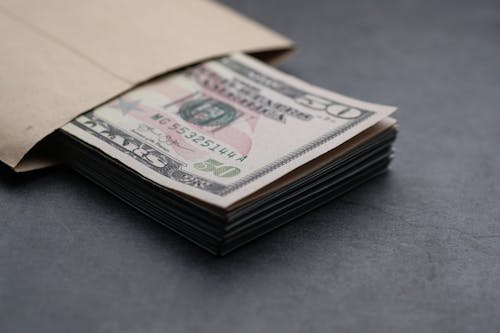 Gratis stockfoto met amerikaanse dollars, bankbiljetten, contant geld