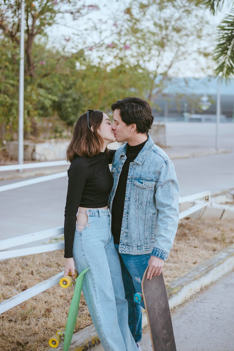 Teenage Couple Kissing In Skate Park