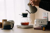 Person brewing pour over coffee