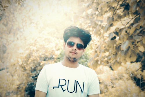 Man in White Crew-neck T-shirt With Sunglasses