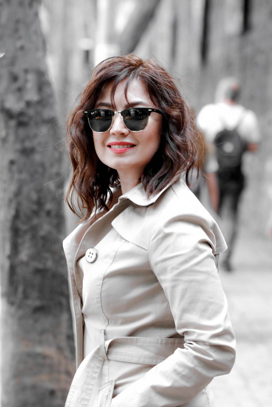portrait of a smiling woman outdoors