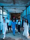 Group of People Standing on Gray Concrete Floor