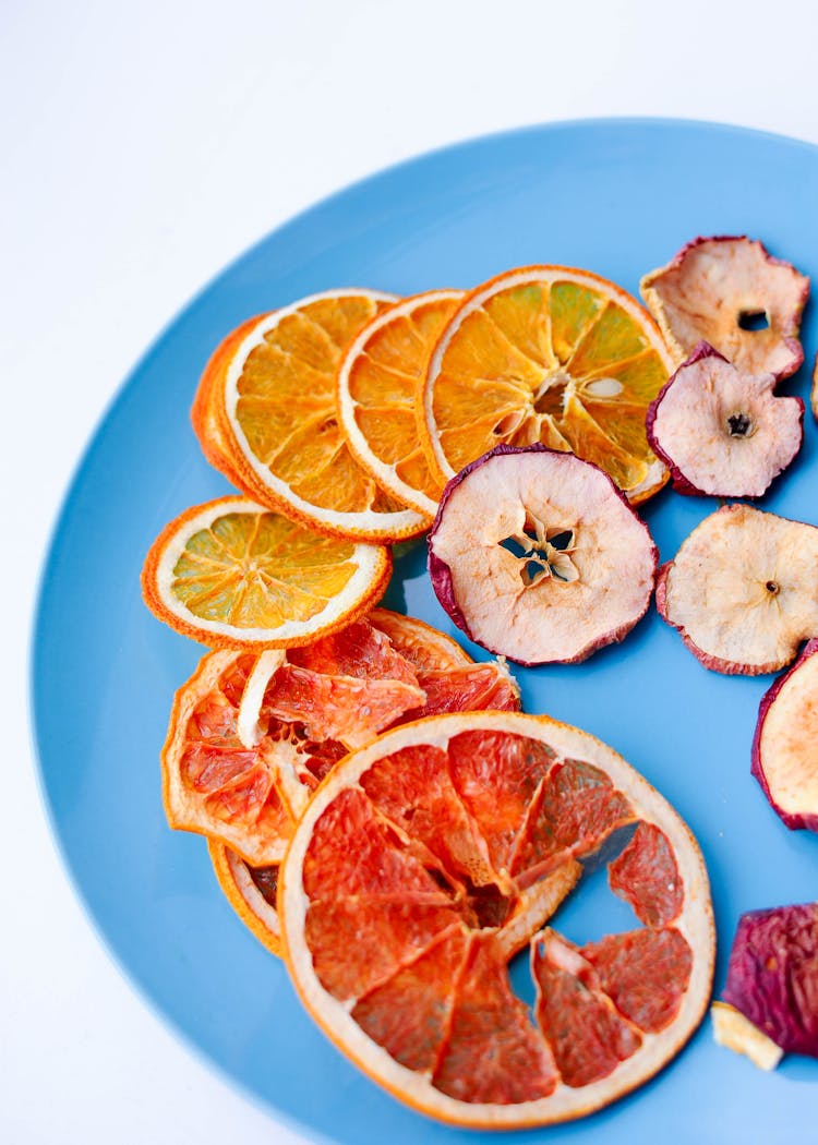 Dried Citrus Slices On Blue Plate