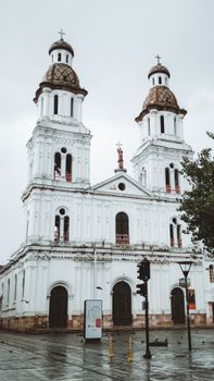 Elegant facade of a historic cathedral in Cuenca, Ecuador, showcasing classic architecture.