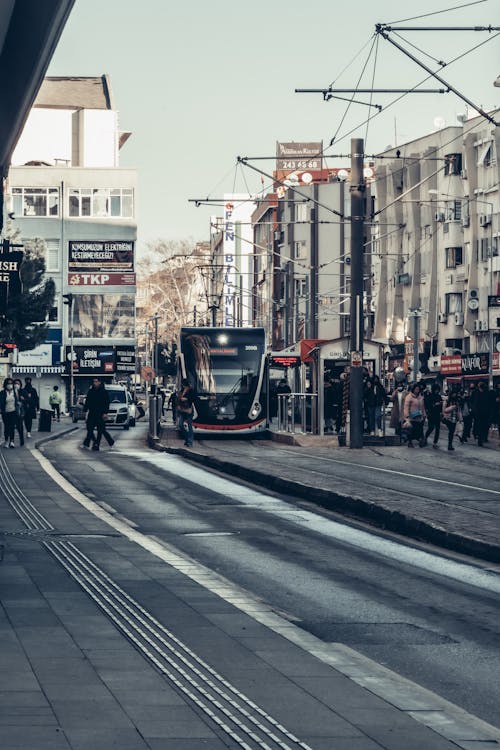 People Walking Near the Tram