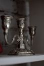 Gold Steel Candle Holder on Red Textile