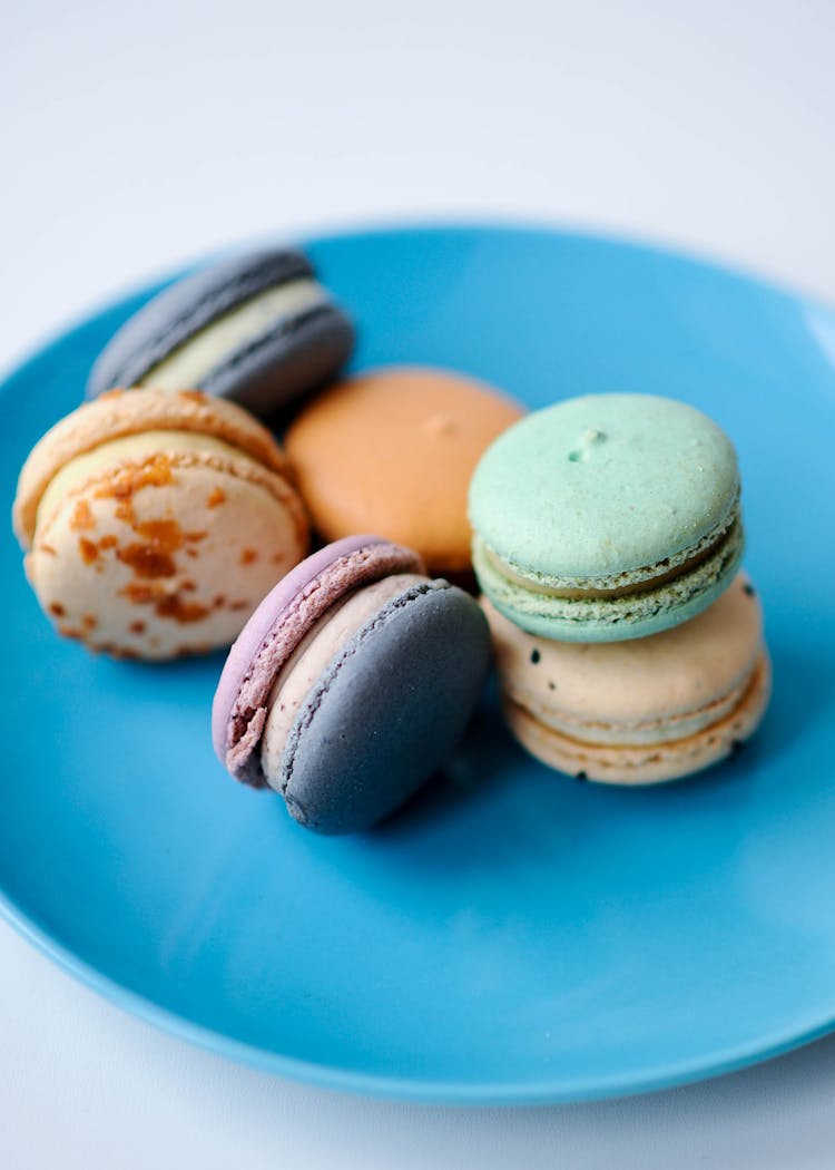 Colorful Macaroons On Blue Plate