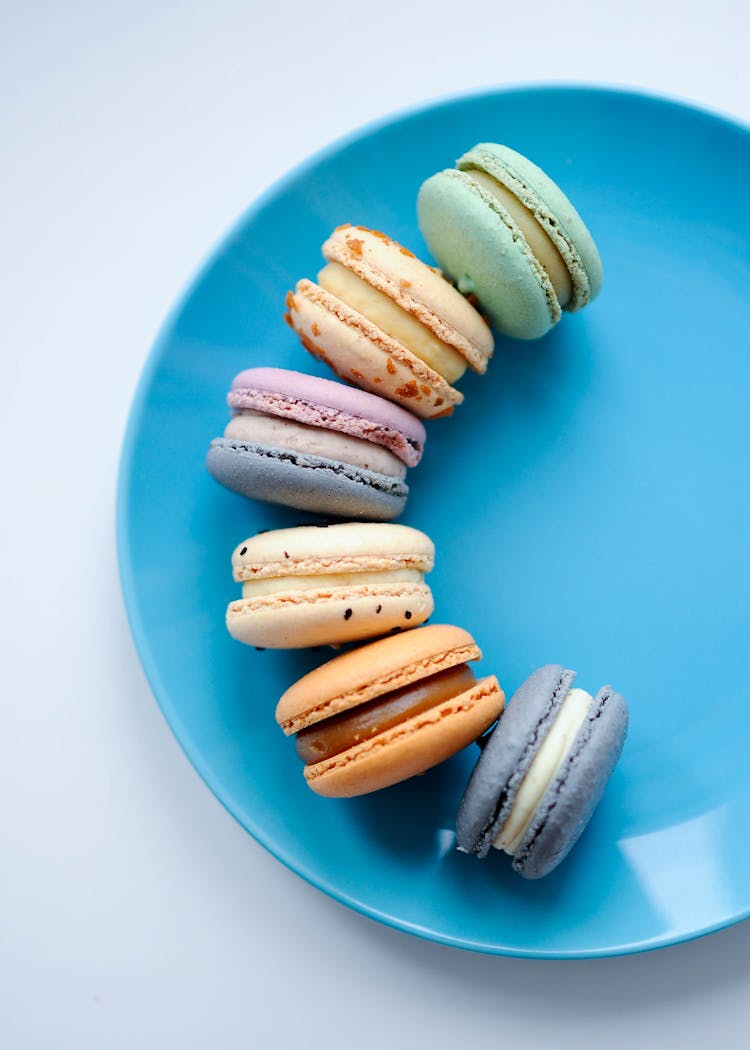 Colorful Macaroons On Blue Plate