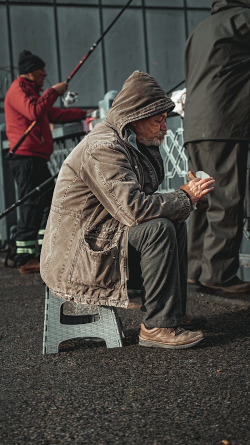 An Elderly Man Having a Snack