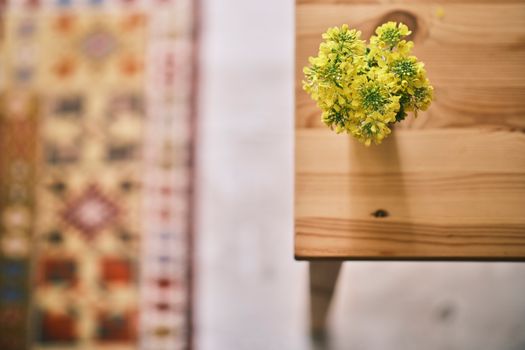 A Turnip Rape Flower on the Wooden Table