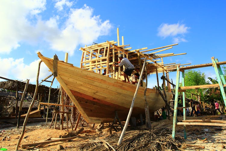 Builders Building A Wooden Boat