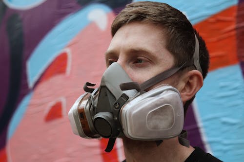 A Man Wearing a Respirator Mask