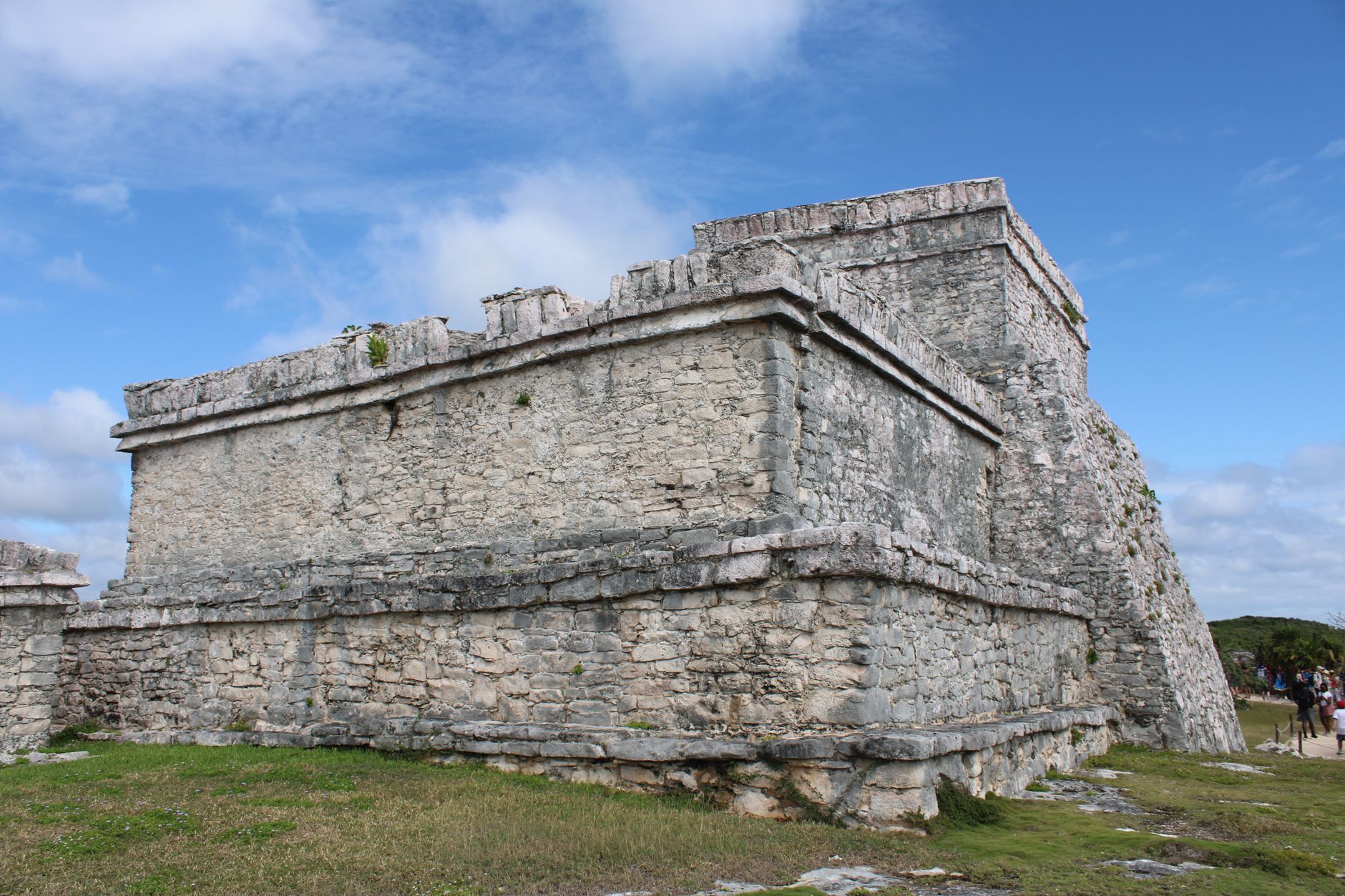 Explore the historic Mayan ruins at Tulum in Mexico, showcasing ancient stone architecture under a clear blue sky.