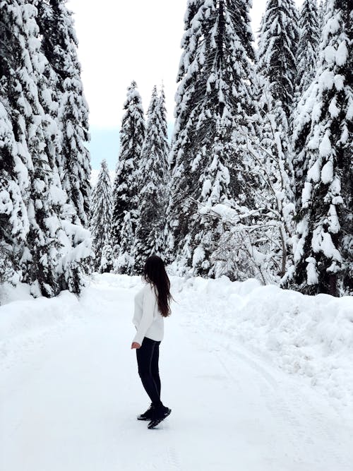 A Woman Walking on Snow