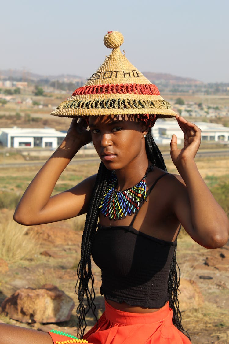 Woman In Traditional Hat And Necklace