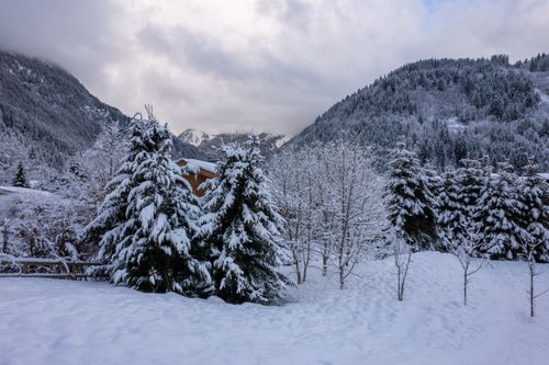 Free Beautiful snowy landscape in Les Contamines-Montjoie, France, showcasing snow-covered trees and mountains. Stock Photo