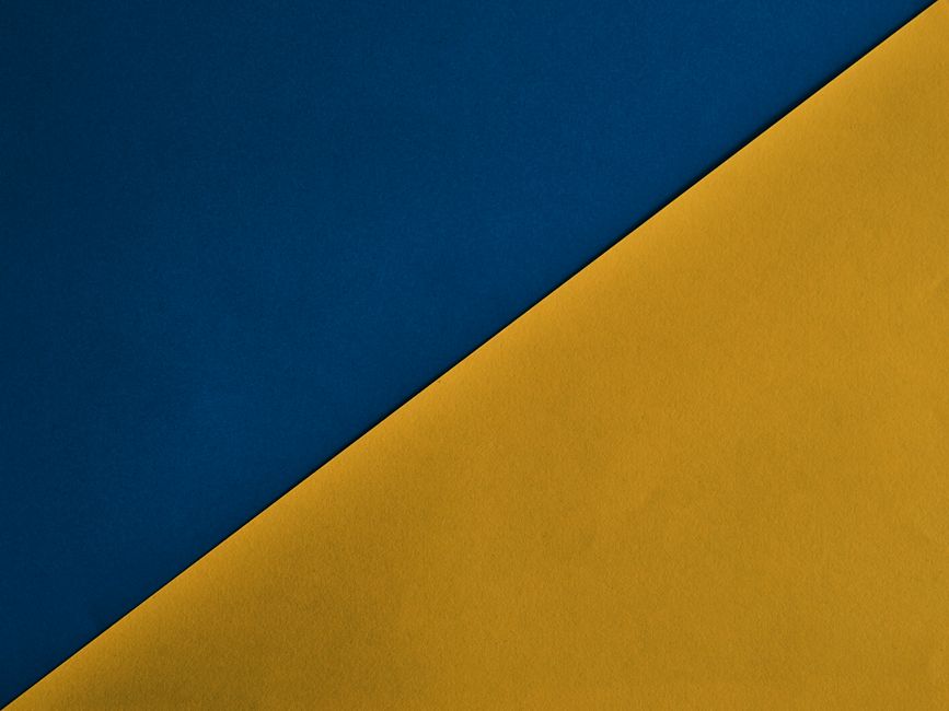 Minimalist abstract design with blue and yellow diagonal colors.