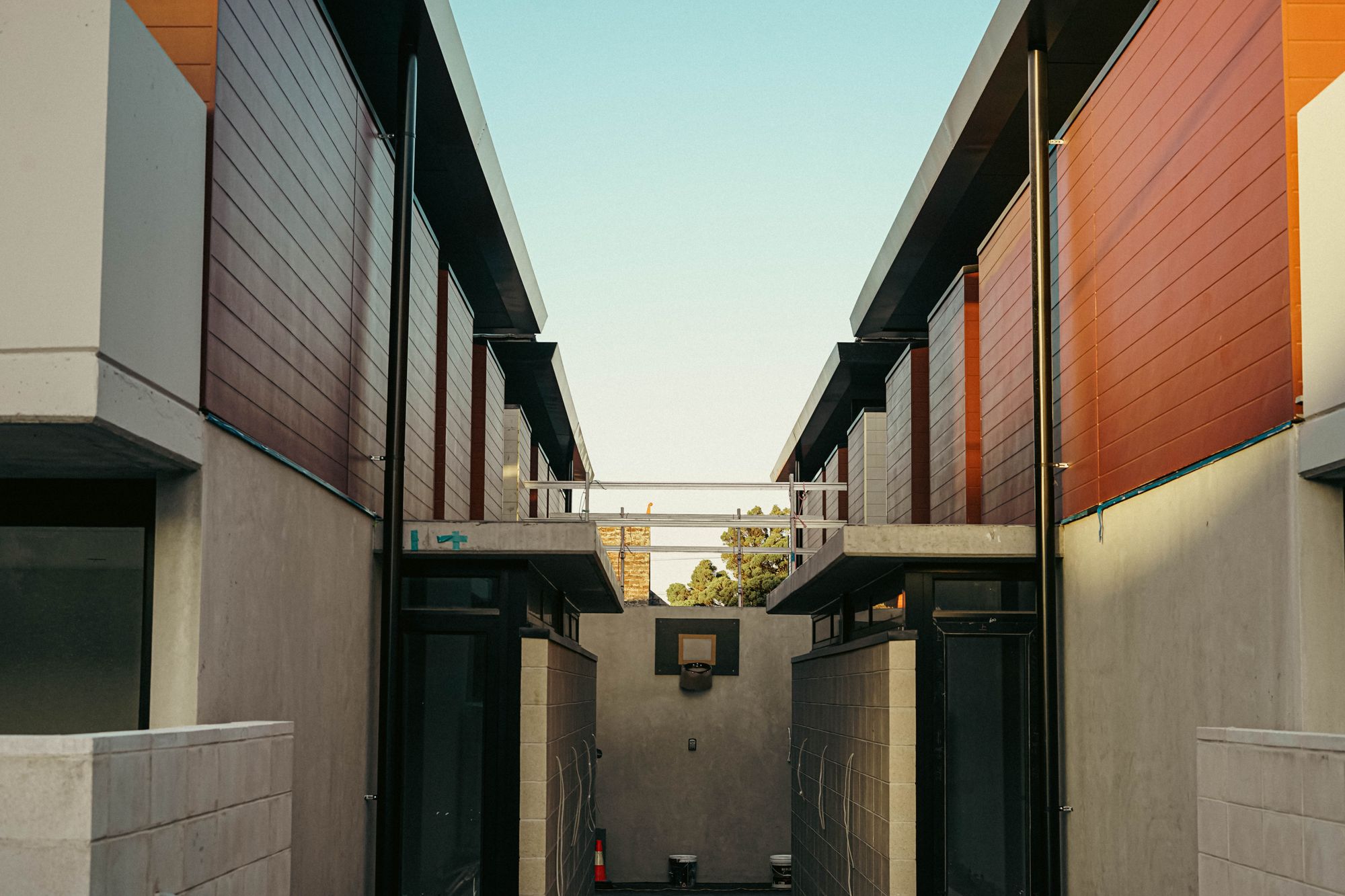 Inner-Melbourne streetscape with low brick shopfronts in Fitzroy