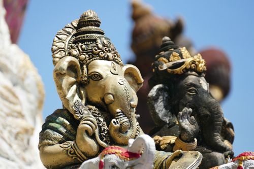 Free Detailed view of Ganesha statues showcasing intricate designs under bright sunlight. Stock Photo