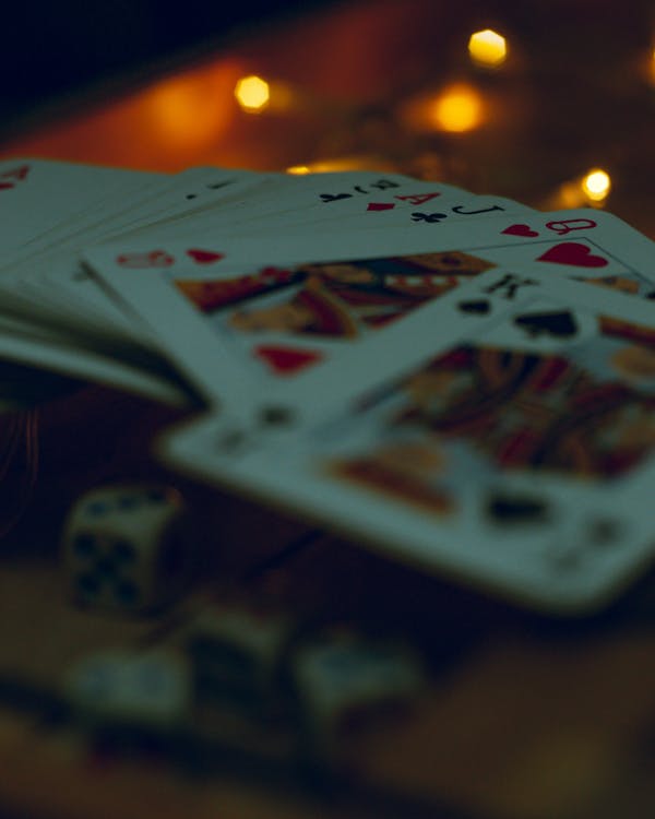 Deck of Playing Cards and Dices in Close-up Photography · Free Stock Photo