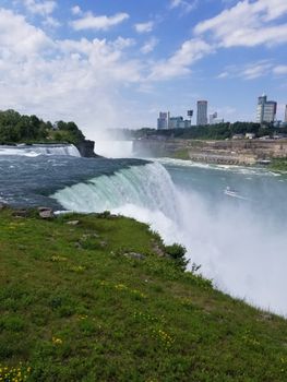 Experience the majestic power of Niagara Falls on a sunny day.