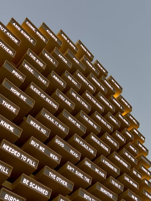 Words Written on Metal Slats on the Building Facade 