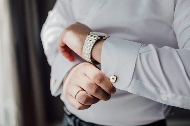 Unrecognizable Man Fastening Cuff Link Of White Shirt