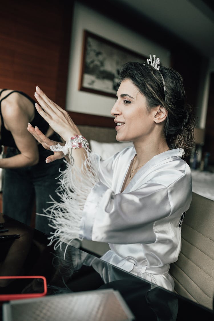 A Woman In White Silk Robe Talking