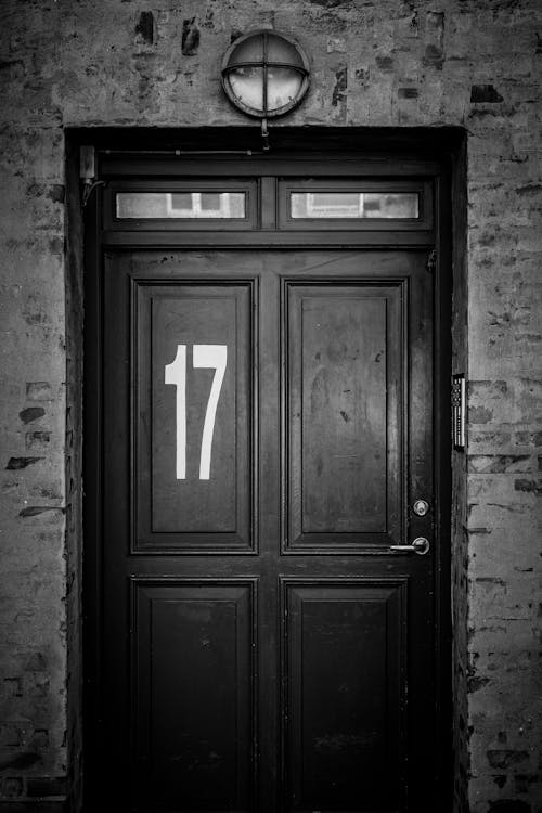 A Grayscale Photo of a Wooden Door