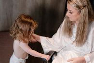 Girl in White Dress Holding Black Tablet Computer