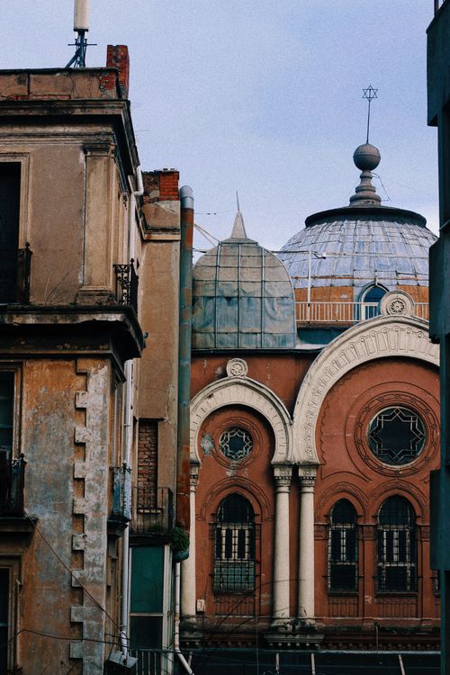 Free A striking view of a historic synagogue dome amidst urban architecture in İstanbul, Turkey. Stock Photo